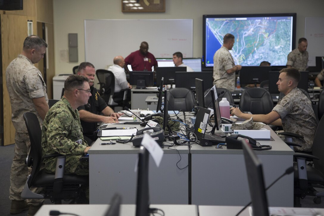 U.S. Marine Corps 1st Lt. Kyle Randow (left), a Military Police Officer with Security and Emergency Services Battalion (SES Bn), Marine Corps Installations West (MCIWEST), Marine Corps Base (MCB), Camp Pendleton and 1st Lt. Bradley Worthan, a Military Police Officer, with SES Bn, MCIWEST-MCB, Camp Pendleton, participate in Exercise Vigilant Shield 2017 (VS-17) on Camp Pendleton, Calif., Oct. 18, 2016. Exercise VS-17 is a US Northern Command command level training event conducted as an Anti-Terrorism/Force Protection Command Post Exercise, and supported by various Field Training Exercises. (U.S. Marine Corps photo by Cpl. Tyler S. Dietrich)