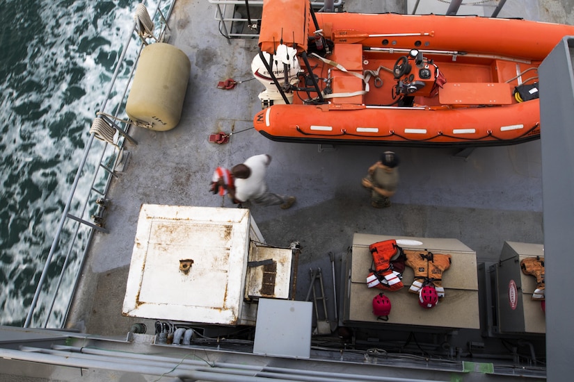Soldiers from the 411th Transportation Detachment run to respond to a drill aboard the MG Charles P. Gross sailing in the Arabian Gulf, October 3, 2016. The Army mariners practice drills and weapons marksmanship routinely when it is not on a mission supporting U.S. Army Central logistics in the Middle East. (Logistics Support Vessel-5), (U.S. Army photo by Sgt. Brandon Hubbard, USARCENT Public Affairs)