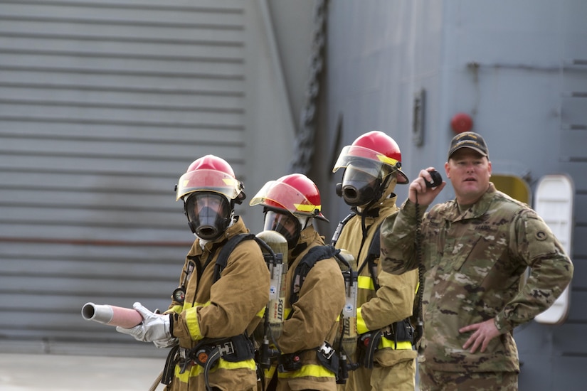 Soldiers from the 411th Transportation Detachment, based at Fort Eustis, Va. and deployed to Kuwait Naval Base, run to react to a notional fire during a drill aboard the MG Charles P. Gross (Logistics Support Vessel-5) in the Arabian Gulf, October 3, 2016. Every Soldier on the ship has to be trained in firefighting response in case of an emergency. (U.S. Army photo by Sgt. Brandon Hubbard, USARCENT Public Affairs)