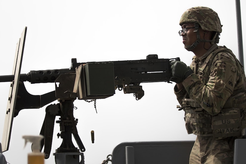 Pfc. Bunnath Chhun, from the 3rd Armored Brigade Combat Team, 1st Infantry Division and a Sheridan, Ind. native, fires the .50 caliber machine gun from the MG Charles P. Gross (Logistics Support Vessel-5) into the Arabian Gulf during a weapons training exercise, October 3, 2016. The ship is part of the large logistics network U.S. Army Central uses to move vehicles and equipment throughout the Central Command theater. (U.S. Army photo by Sgt. Brandon Hubbard, USARCENT Public Affairs)