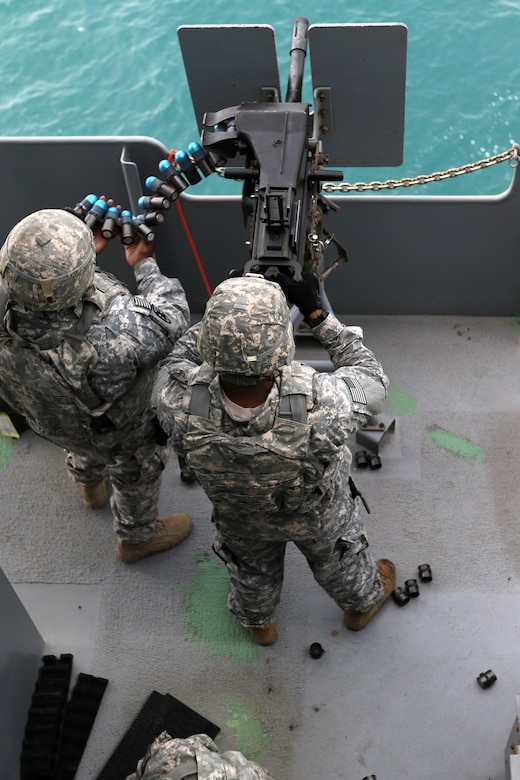 Soldiers from the 411th Transportation Detachment, U.S. Army Central, fire the Mk19 grenade launcher at a “Killer Tomato” target in the Arabian Gulf, Oct. 3, 2016. The ship is part of the large logistics network U.S. Army Central uses to move vehicles and equipment throughout the Central Command theater. (U.S. Army photo by Sgt. Brandon Hubbard, USARCENT Public Affairs)