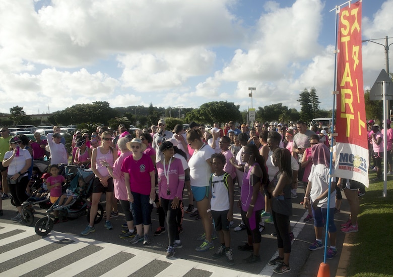Participants line up at the starting line for the Second Annual Breast Cancer Awareness 5-kilometer Run, Oct. 1, aboard Camp Lester, Okinawa, Japan. The event provided an opportunity for Status of Forces Agreement members to show solidarity and support for survivors of breast cancer by participating in the five-kilometer event. The event was one of the many events designed to promote a healthier lifestyle in the military community on Okinawa. (U.S. Marine Corps photo by Cpl. Janessa K. Pon / Released)