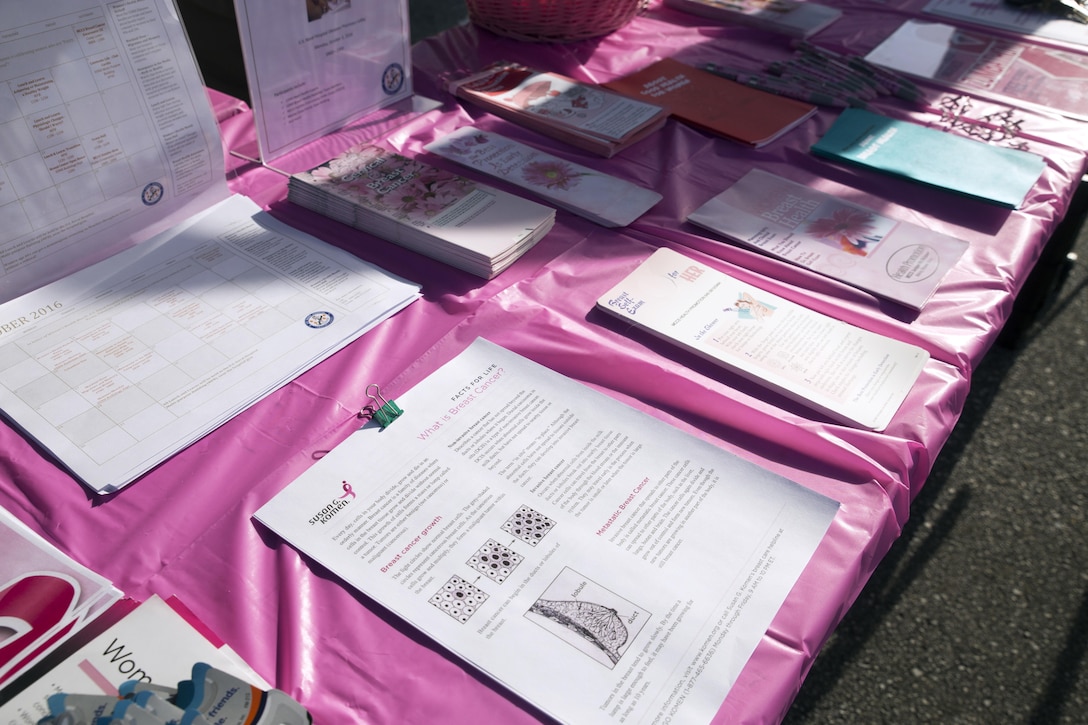 Informational pamphlets about breast cancer rest on a table during the Second Annual Breast Cancer Awareness 5-kilometer Run Oct. 1 aboard Camp Lester, Okinawa, Japan. The event provided an opportunity for Status of Forces Agreement members to show solidarity and support for survivors and breast cancer and their families. During the event, Marine Corps Community Services Health Promotion staff provided information on available support groups and services form breast cancer survivors and their families. (U.S. Marine Corps photo by Cpl. Janessa K. Pon / Released)
