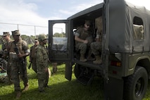 U.S. Marines and Japan Ground Self-Defense Force members mount Japanese tactical vehicles in preparation for the patrolling portion of the annual Guard and Protect, an observe and exchange event, Oct. 6 on Marine Corps Air Station Futenma, Okinawa, Japan. The three-day exchange allowed U.S. service members and JGSDF service members to sharpen their tactical skills through observation of each other’s operational procedures. The event covered troop movement, communication, and vehicle search and seizure skills.