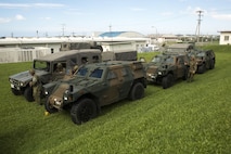 Japan Ground Self-Defense Force tactical vehicles stand staged during the annual Guard and Protect, an observe and exchange event, Oct. 6 on Marine Corps Air Station Futenma, Okinawa, Japan. The event was a three-day training evolution that allowed U.S. service members and JGSDF service members to observe each other’s tactical procedures and operations. The training covered troop movement, communications, and vehicle search and seizure.