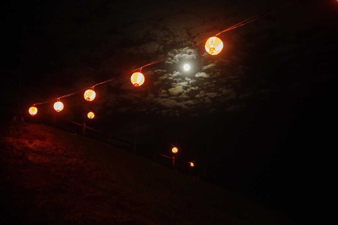 Party lanterns light the way to a more secluded moon viewing area at the top of the mountain during the Moon Viewing Ceremony at Mt. Ishikawa, Okinawa, Japan, October 15, 2016. The Moon Viewing Ceremony, or Tsukimi, is an Okinawan tradition to celebrate the coming of fall. Although the moon may not always be full on the moon light parties, it is said by the Okinawans that the moon is the brightest and the most beautiful on this night. (U.S. Marine Corps photo by Lance Cpl. Breanna Weisenberger / Released)