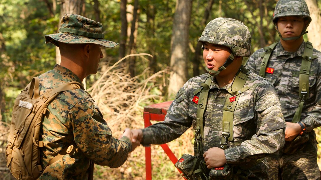 Sgt. Maj. Michael A. Miller, Sergeant Major of Combat Logistics Regiment 3, meets with Republic of Korea Marines during a bilateral leadership reaction course at Camp Mujuk, Republic of Korea, October 14, 2016. The LRC is a course designed to provide formal leadership instruction while teaching participants to work together as a team. Strengthening partnerships with regional allies, and enhancing response capabilities help maintain peace and regional security.