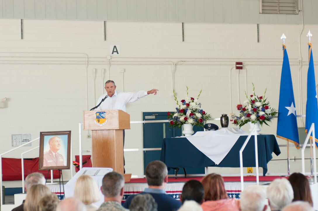 Retired Maj. Gen. Wess P. Chambers points in the direction of the unit’s first dirt floor hangar as he recounts the career of retired Maj. Gen. Donald E. Morris during a ceremony October 14.  The ceremony honored the life and memory of the unit’s first and longest serving commander who died June 7, 2016. (U.S. Air National Guard photo by 1st Lt. Lacey Roberts)