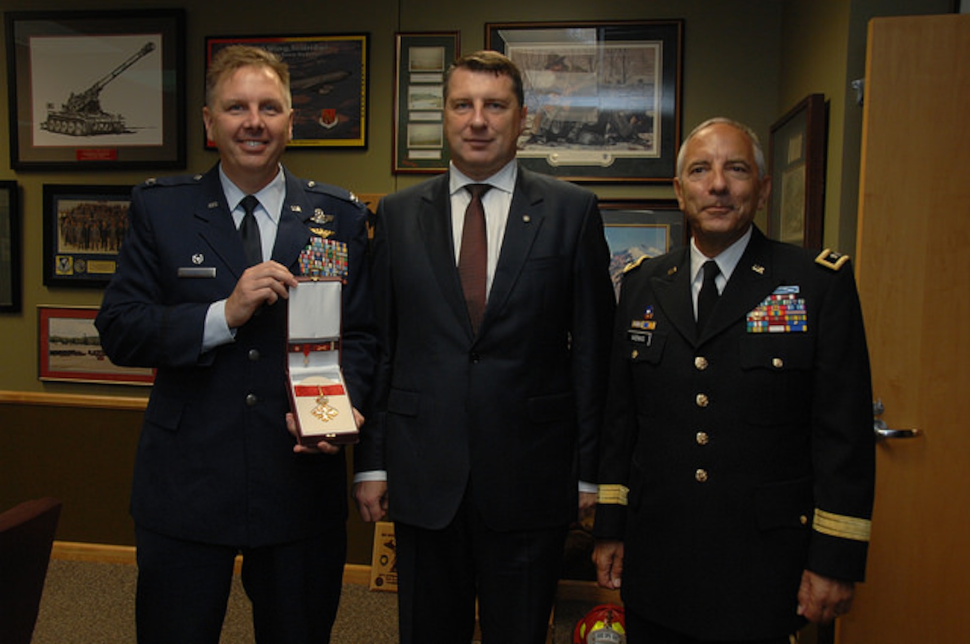 The President of the Republic of Latvia  presented Col. J. Andrew Roberts, commander of the Alpena Combat Readiness Training Center, with the Order of Viesturs medal, Sept. 23, 2016, at the Michigan National Guard headquarters facility in Lansing. The Order of Viesturs is presented only by the President and was given to Roberts to recognize his efforts toward strengthening the country and promoting joint learning between military forces. Roberts served as the bilateral affairs officer to Latvia in 2012 and 2013. Major General Vadnais present on right  (Michigan National Guard photo by Angela Simpson/released).