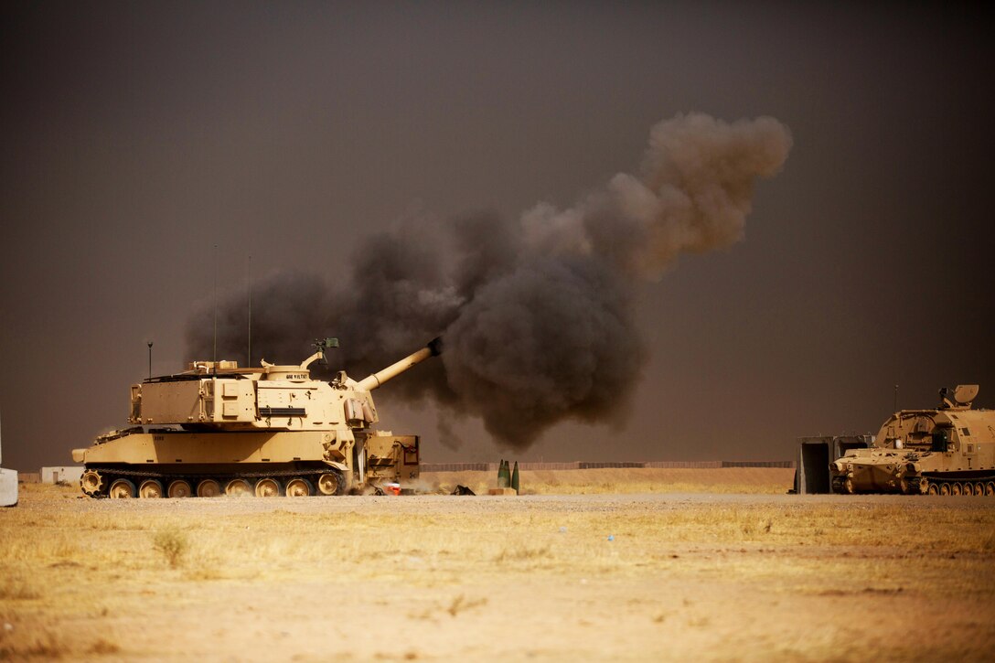 A U.S. Army M109A6 Paladin conducts a fire mission at Qayyarah West, Iraq, in support of the Iraqi security forces’ push toward Mosul, Oct. 17, 2016.  The support provided by the Paladin teams denies the Islamic State of Iraq and the Levant safe havens while providing the ISF with vital artillery capabilities during their advance. The United States stands with a Coalition of more than 60 international partners to assist and support the Iraqi security forces to degrade and defeat ISIL.  (U.S. Army photo by Spc. Christopher Brecht)
