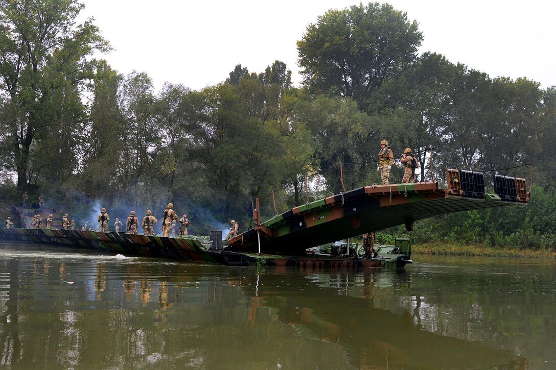 U.S. and Italian soldiers participate in river crossing training during Livorno Shock, an exercise in Piacenza, Italy, Oct. 17, 2016. The U.S. soldiers are paratroopers assigned to 54th Brigade Engineer Battalion, 173rd Airborne Brigade. The combined readiness exercise  familiarizes U.S. paratroopers with river crossing capabilities. Army photo by Massimo Bovo