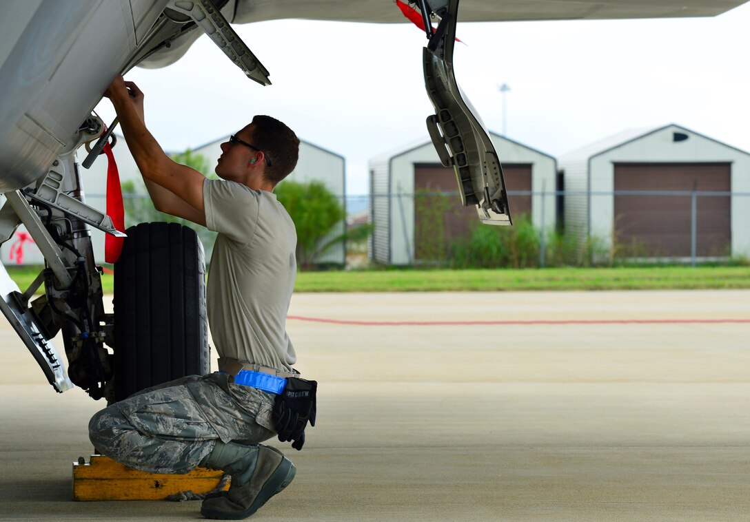 U.S. Air Force Airman Samuel Gulbranson, 1st Aircraft Maintenance Squadron weapons load crew member, loads countermeasures into an aircraft at Joint Base Langley-Eustis, Va., Sept. 30, 2016. The 633d Air Base Wing, 1st and 192nd Fighter Wings tested their readiness if they were faced with a possible disaster, imminent terrorist, enemy threat or short-notice orders to deploy. (U.S. Air Force photo by Airman 1st Class Tristan Biese)