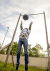Senior Airman Mark Schwab, 450th Intelligence Squadron, throws a ball over a bar during the 693rd Intelligence, Surveillance and Reconnaissance Group’s 5th Annual Highland Games in Wiesbaden, Germany, Oct. 14, 2016. Each squadron under the 693rd ISRG had a commander’s team compete during the games for bragging rights and a trophy. However, other Airmen formed teams to add some friendly competition. (U.S. Air Force photo by Staff Sgt. Timothy Moore)