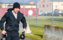 Airman 1st Class Devin Swain, 24th Intelligence Squadron, runs with kettle bells during the Farmer’s Carry competition of the 693rd Intelligence, Surveillance and Reconnaissance Group’s 5th Annual Highland Games in Wiesbaden, Germany, Oct. 14, 2016. The Highland Games consisted of several events including an axe throw, kettle bell relay, truck pull and tire flip competition. (U.S. Air Force photo by Staff Sgt. Timothy Moore)