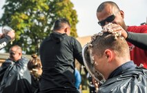 Members of the 693rd Intelligence, Surveillance and Reconnaissance Group shove pie in friends and coworker’s faces during the Pie-in-the-Face portion of the 693rd ISRG’s 5th Annual Highland Games in Wiesbaden, Germany, Oct. 14, 2016. Members of the 693rd ISRG donated money to have other members of the group hit in the face with a pie. All proceeds raised for the event were donated to the Combined Federal Campaign-Overseas. (U.S. Air Force photo by Staff Sgt. Timothy Moore)