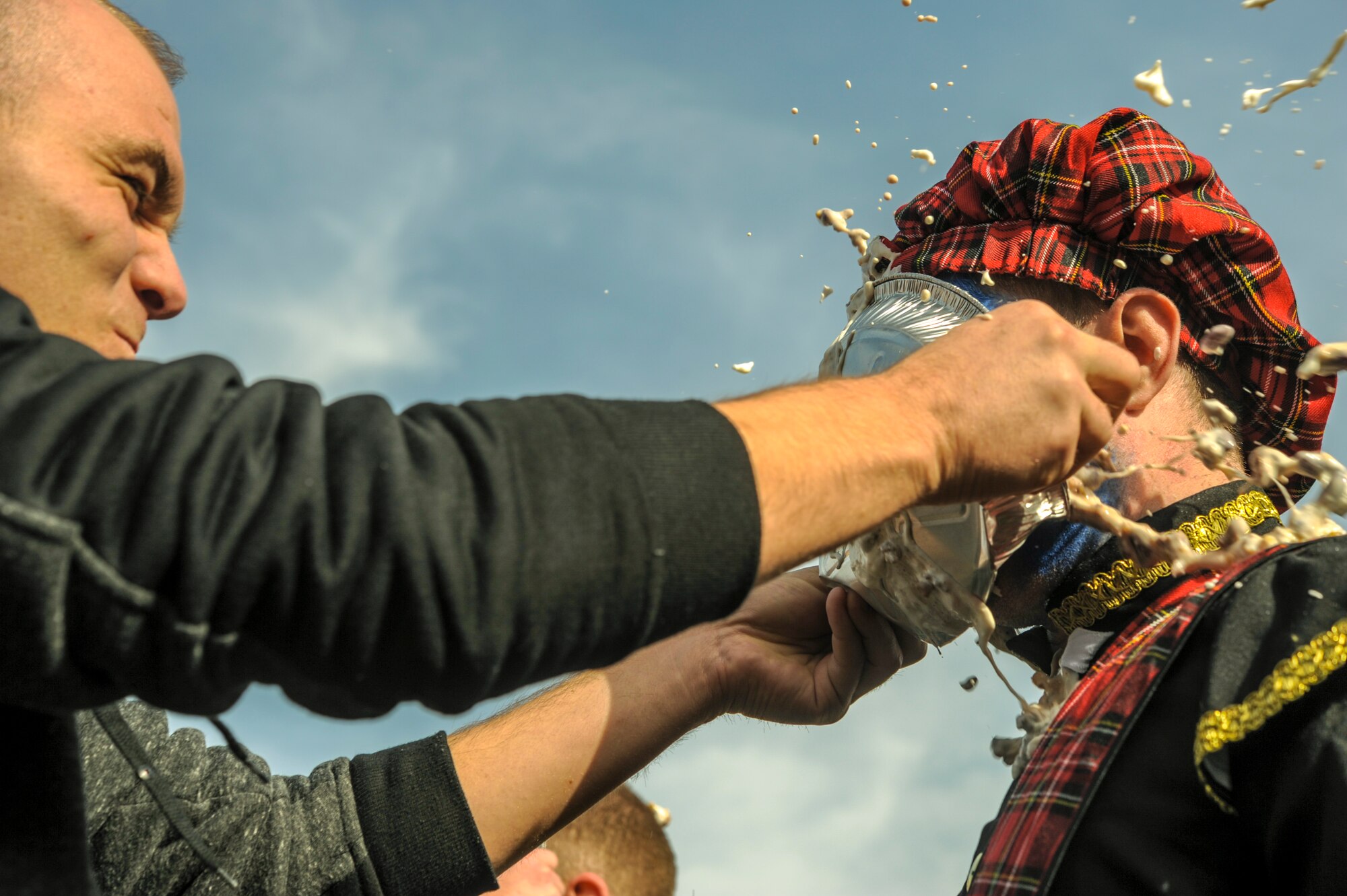 Senior Airman Joshua Bungard hits Senior Airman Joshua Banwart, both 485th Intelligence Squadron, in the face with a pie during the Pie-in-the-Face portion of the 693rd Intelligence, Surveillance and Reconnaissance Group’s 5th Annual Highland Games in Wiesbaden, Germany, Oct. 14, 2016. Members of the 693rd ISRG donated money to have other members of the group hit in the face with a pie. All proceeds raised for the event were donated to the Combined Federal Campaign-Overseas. (U.S. Air Force photo by Staff Sgt. Timothy Moore)