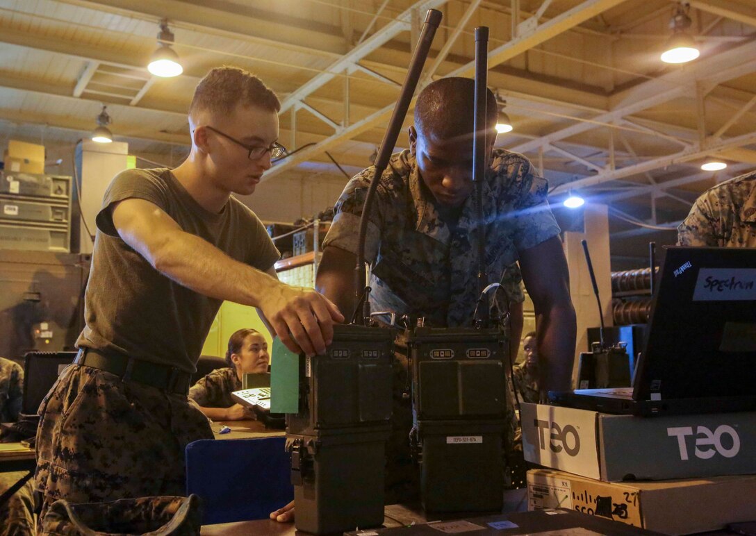 Marines sync their radios during a training exercise at Camp Lejeune, N.C., Oct. 17, 2016. Four units where present for Adaptive Network Wideband Waveform training, which focused on the units configuring their equipment in order to communicate with each other without an internet service. The Marines come from various communication specialties within 2nd Marine Logistics Group. (U.S. Marine Corps photo by Lance Cpl. Ashley Lawson) 