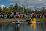 More than 200 spectators surrounded the golf course pond to watch teams compete in the 2nd Annual DLA Land and Maritime Cardboard Boat Regatta. The races were part of the activities celebrating the Navy's 241st birthday, while also raising funds for the agency's Combined Federal Campaign philanthropic program. 