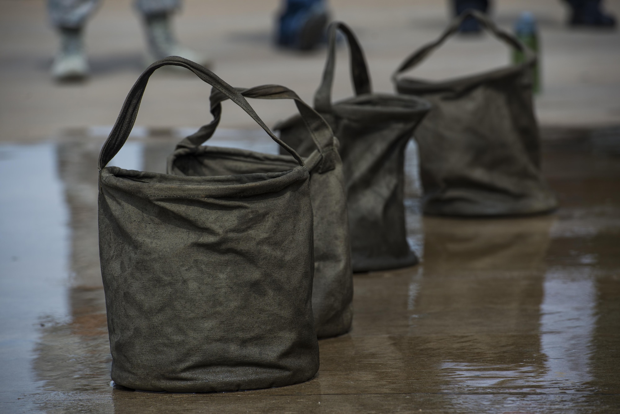 Airmen competing in the Sheppard Air Force Base, Texas, firefighter challenge, use these buckets in a bucket brigade, Oct. 14, 2016. The bucket brigade challenge involves transporting water from a nearby reservoir, to an empty oil drum. Each team must fill the drum until balls floating inside overflow. (U.S. Air Force photo by Senior Airman Kyle E. Gese)