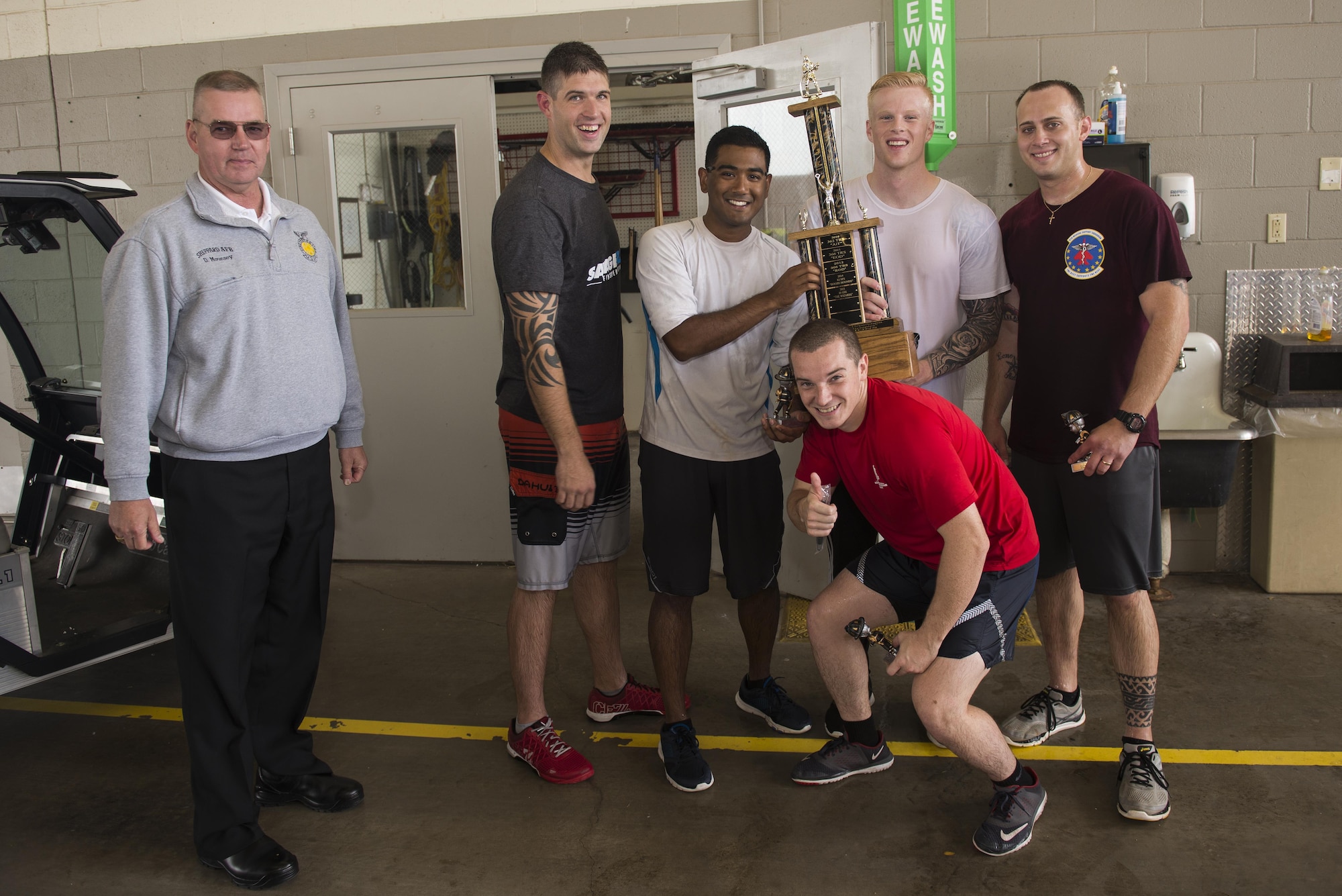 The 82nd Medical Group team receives the Sheppard Air Force Base, Texas, firefighter challenge championship trophy, Oct. 14, 2016. The firefighter challenge demonstrates various tasks firefighters might have to perform in order to fight fires and save lives. (U.S. Air Force photo by Senior Airman Kyle E. Gese)