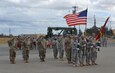 The color guard for the 483rd Terminal Battalion and the American flag stand at attention, during a change of command ceremony, where at the Lt. Col. Thomas J. Harzewski, a Rio Rancho, New Mexico resident, assumed command of the 483rd Terminal Battalion from Lt. Col. Kevin O. McKenzie at the Military Ocean Terminal Concord, October 15. Toni A. Glover, 650th Regional Support Group commander, located in Las Vegas, Nevada, was present to transfer the unit colors to Harzewski from McKenzie, who has led the unit for two years.