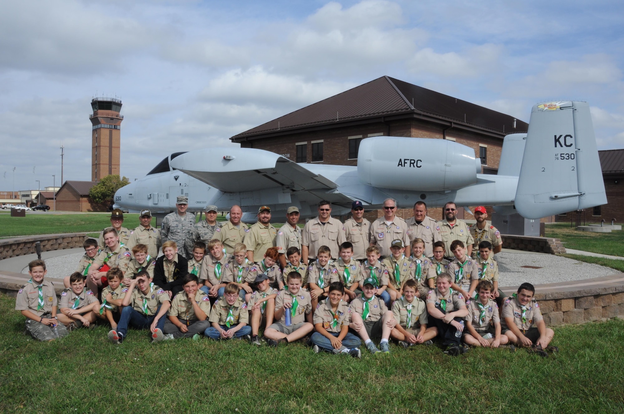 Lee's Summit Boy Scout Troop 54 gathers in front of a static A-10 Thunderbolt II from the 442nd Fighter Wing at Whiteman Air Force Base, Mo., Oct. 15, 2016. Boy Scouts provides an opportunity for younger kids to bond over monthly events with their fathers and other adults that mentor the kids. (U.S. Air Force photo/Senior Airman Missy Sterling)