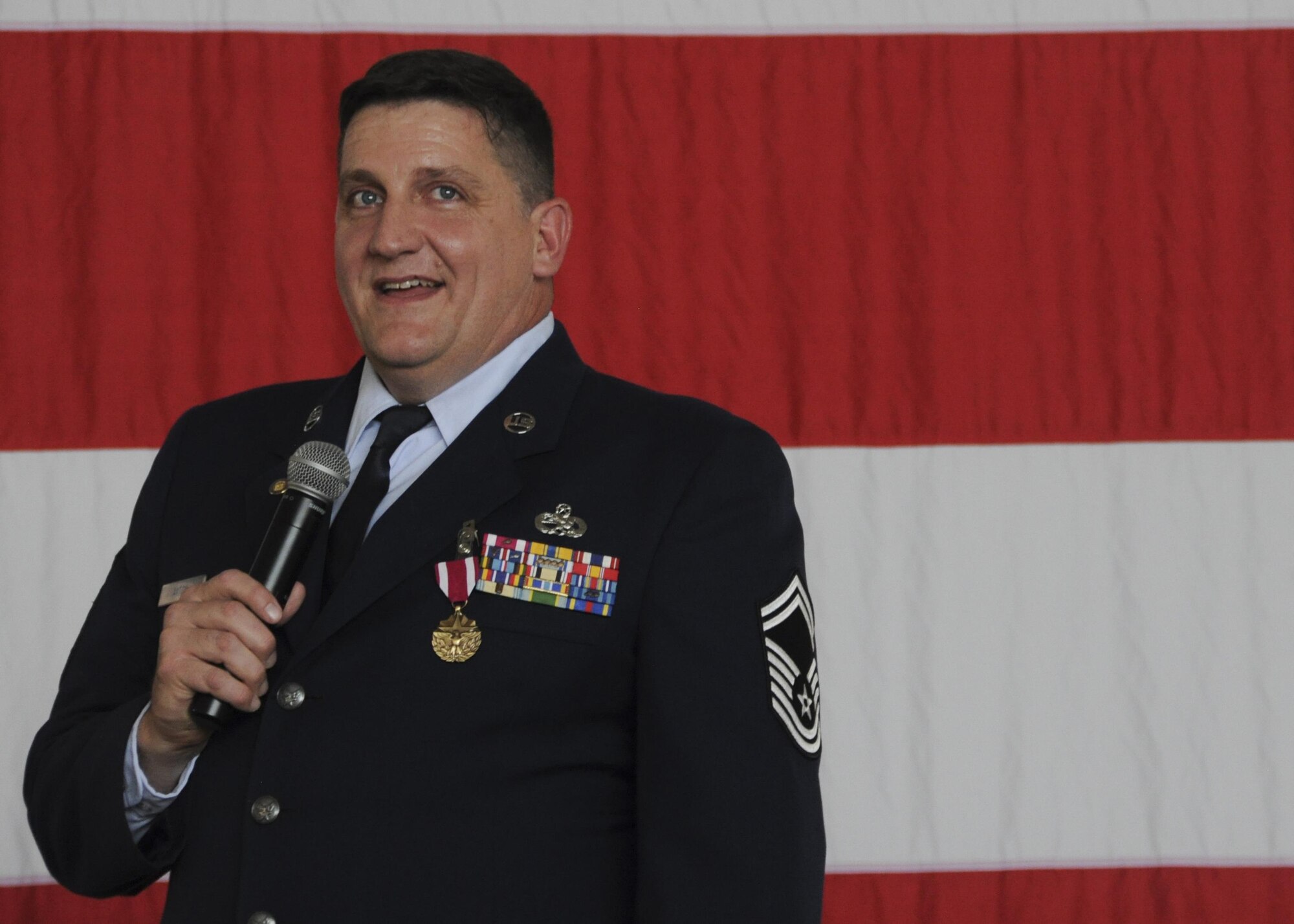 Senior Master Sgt. Anthony Axton, 442nd Aircraft Maintenance Squadron Accessory Flight Chief, addresses the crowd during his retirement ceremony at Whiteman Air Force Base, Mo., Oct. 16, 2016. In 1985, he enlisted into the 442nd Consolidated Aircraft Maintenance Squadron. He took a break in service from 91-96 until he re-enlisted in 2007. During his cross-training to become the fuels system section chief he was awarded distinguished graduate and was one of the few Airmen who has obtained 100% in the entire course. (U.S. Air Force photo/Senior Airman Missy Sterling)