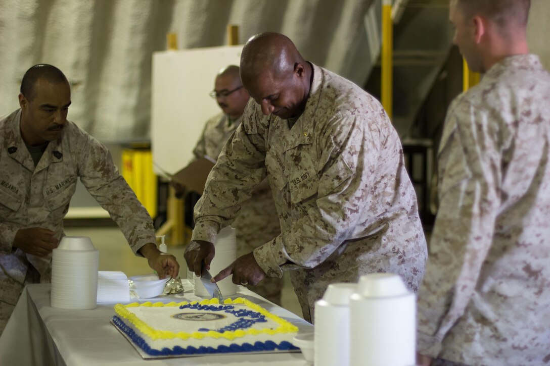 Lieutenant commander Arthur L. Wiggins Jr. cuts the 241st anniversary cake at Camp Wilson Calif. Oct 13, 2016. The cutting of the cake ceremony is a tradition in which the first piece of cake goes to the oldest sailor and the youngest sailor to signify the passing of the torch from one generation to another. Wiggins is the chaplain for 4th Marine Regiment, 3rd Marine Division. (U.S. Marine Corps photo by Lance Cpl. Juan A. Soto-Delgado)