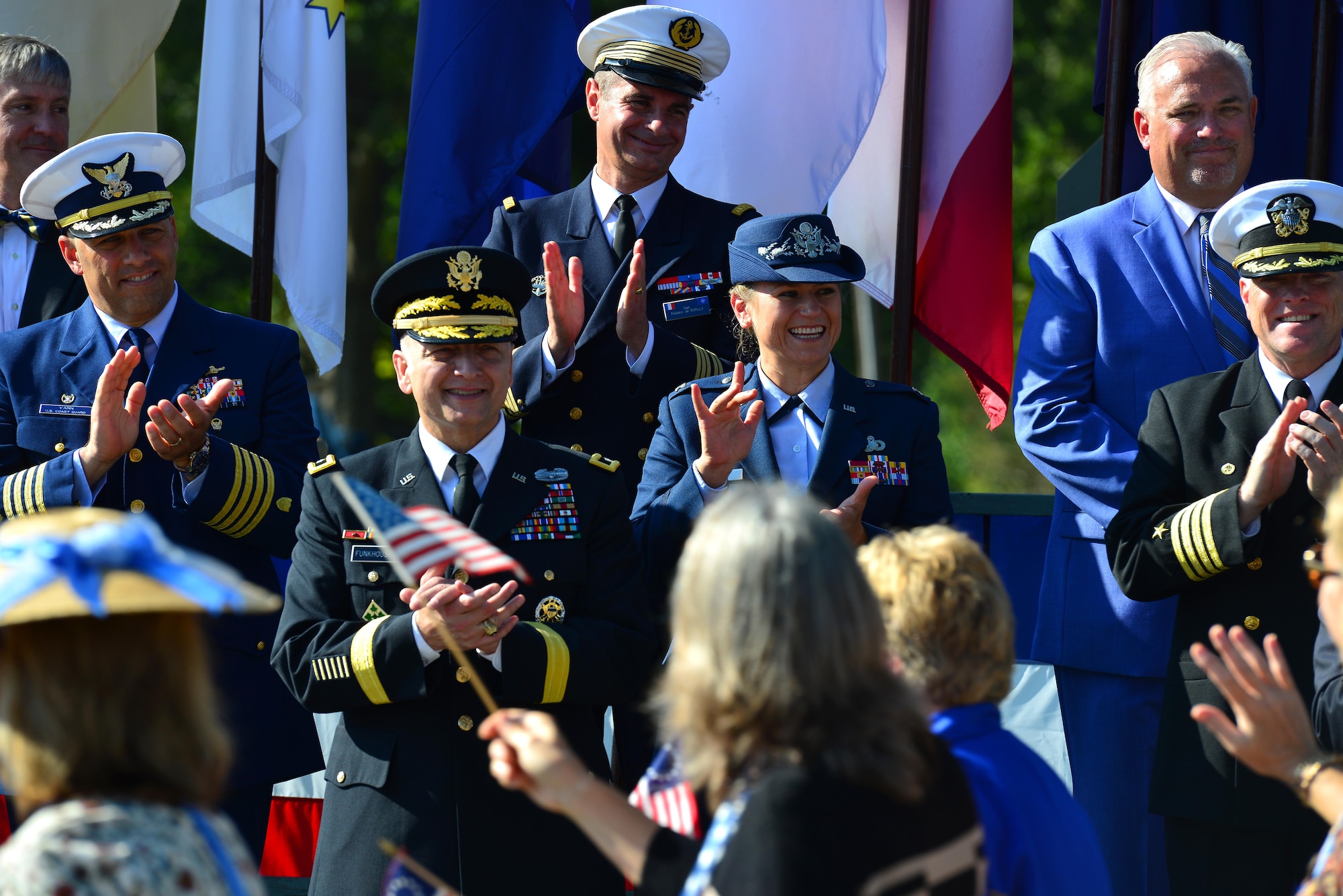 U.S. Army Maj. Gen. Anthony Funkhouser, Center for Initial Military Training commander, and U.S. Air Force Col. Caroline Miller, 633rd Air Base Wing commander, join local leadership as they celebrate Yorktown day in Yorktown Va., Oct. 19, 2016. Many locals marched in the parade and participated in a patriotic exercise to commemorate the 235th anniversary of America’s Revolutionary War victory at Yorktown. (U.S. Air Force photo by Airman 1st Class Tristan Biese)