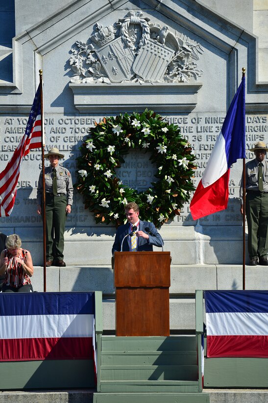 Conrad Jackson, with the Children of the American Revolution, speaks during a wreath-laying ceremony at the French Monument in Yorktown Va., Oct. 19, 2016. People from all over the region gathered during the Yorktown Day parade to celebrate when the American and French won the battle of Yorktown in 1781. (U.S. Air Force photo by Airman 1st Class Tristan Biese)