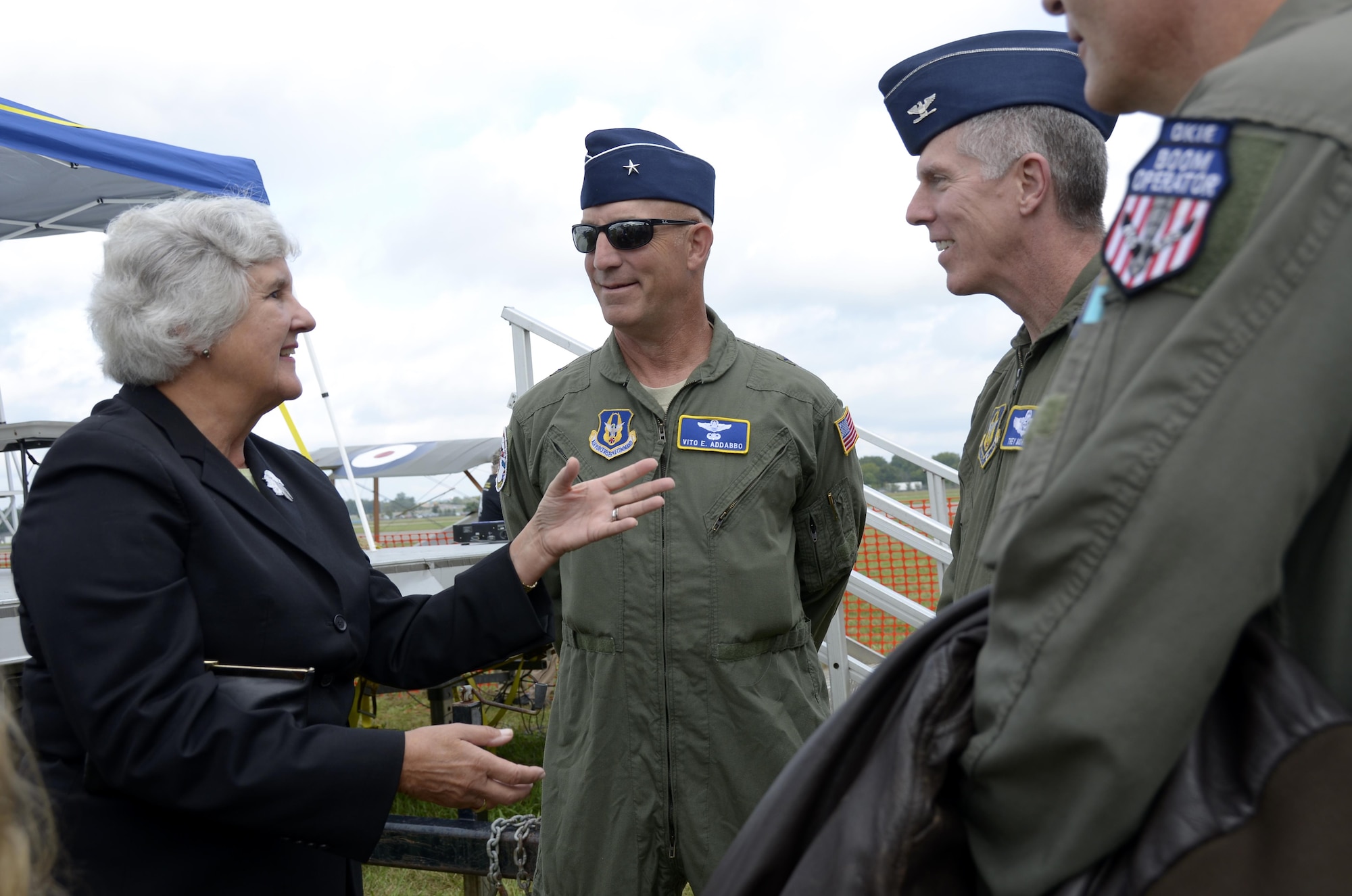 Susan d’Olive, daughter of 1st Lt. Charles d’Olive, the last officially recognized U.S. “Ace” of World War I, shares some memories with Brig. Gen. Vito Addabbo, Mobilization Assistant to the Commander, Air Force Global Strike Command, Barksdale Air Force Base, Louisiana, and Lt. Col James Morriss, vice commander of the 307th Bomb Wing, Barksdale AFB, at the Dawn Patrol Rendezvous event held at the National Museum of the United States Air Force in Ohio, Oct. 1, 2016.  All three were part of a painting unveiling ceremony honoring d’Olive and 100 years of Reserve Airpower. (U.S. Air Force photo/Staff Sgt. Joel McCullough)