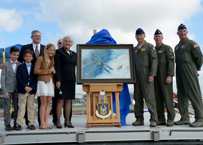 (left to right) Susan d’Olive, daughter of 1st Lt. Charles d’Olive, the last officially recognized U.S. “Ace” of World War I, and her family pose with Senior Master Sgt. Darby Perrin, an Air Force artist from the 465th Air Refueling Squadron, Tinker Air Force Base, Oklahoma, Lt. Col James Morriss, vice commander of the 307th Bomb Wing, Barksdale Air Force Base, Louisiana, and Brig. Gen. Vito Addabbo, Mobilization Assistant to the Commander, Air Force Global Strike Command, Barksdale AFB, at the National Museum of the United States Air Force in Ohio, Oct. 1, 2016. (U.S. Air Force photo/Staff Sgt. Joel McCullough)