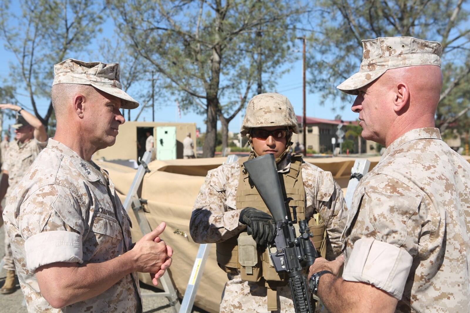 U.S. Marine Corps Sgt. Oscar Tapia demonstrates the capabilities of an amphibious assault fueling station to Lt. Gen. Lewis Craparotta, the commanding general of the I Marine Expeditionary Force, and Brig. Gen. David Ottignon, the commanding general of 1st Marine Logistics Group, aboard Camp Pendleton, Calif., Oct. 19, 2016. Craparotta visited the 1st MLG to see the most up-to-date capabilities the logistics command has to offer I MEF. Tapia is a combat engineer with 7th Engineer Support Battalion, 1st Marine Logistics Group. (U.S. Marine Corps photo by Lance Cpl. Joseph Sorci)