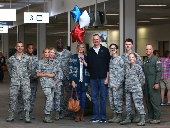 Master Sgt. Scott D. Shields, 445th Operations Support Squadron combat communications, is greeted by his fellow Airmen from OSS, family and friends at the Dayton International Airport Oct. 1, 2016. Shields is returning from an eight-month deployment to Guam where he covered a shortfall for an Air Expeditionary Force tour. While deployed, Shields was responsible for processing communication security material for the aircrew that were flying the lines during the deployment and supporting the commander and first sergeant at his deployed location. (U.S. Air Force photo/Tech. Sgt. Patrick O’Reilly)