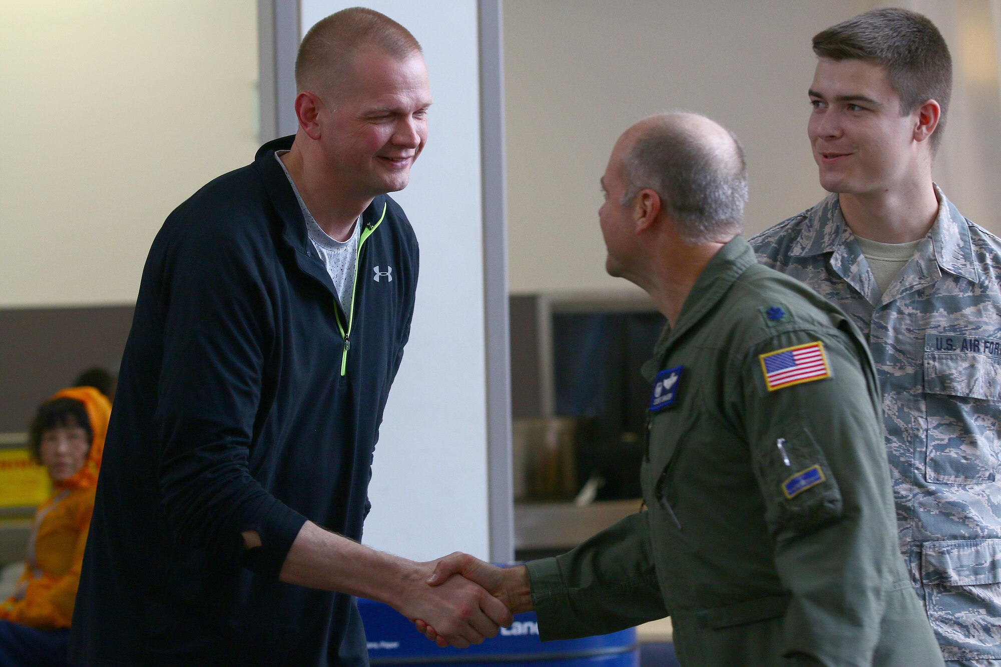 Master Sgt. Scott D. Shields, 445th Operations Support Squadron combat communications, is greeted by Lt. Col. Steve Shroder, Jr., 445th OSS commander, at the Dayton International Airport Oct. 1, 2016. Airmen from the 445th OSS, family and friends welcomed Shields back after he returned from an eight-month deployment to Guam. Shields covered a shortfall for an Air Expeditionary Force tour. While deployed, he was responsible for processing communication security material for the aircrew that were flying the lines during the deployment and supporting the commander and first sergeant at his deployed location. (U.S. Air Force photo/Tech. Sgt. Patrick O’Reilly)