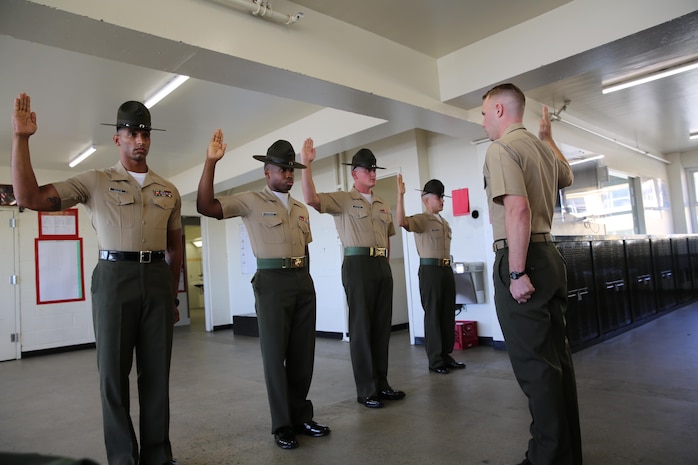 Drill instructors from Charlie Company, 1st Recruit Training Battalion, recite the Drill Instructor Creed during pick up at Marine Corps Recruit Depot San Diego, Oct. 14. After spending the first week conducting in-processing, recruits marched to their new squad bay where their drill instructors introduced themselves, recited the Drill Instructor Creed and began carrying out the mission of transforming civilians into United States Marines. Annually, more than 17,000 males recruited from the Western Recruiting Region are trained at MCRD San Diego. Charlie Company is scheduled to graduate Jan. 6.