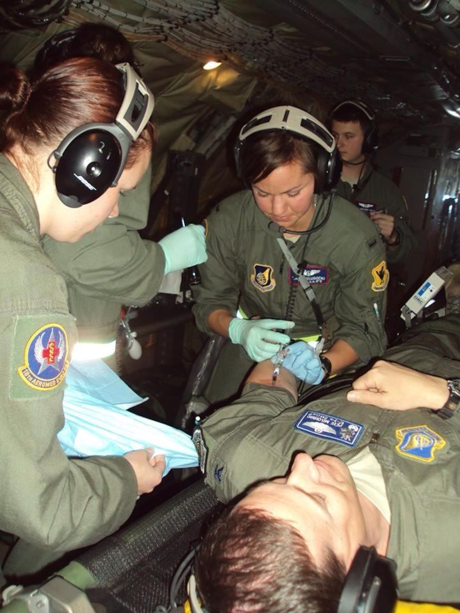 Capt. Katherine Slugocki plays nurse using her mom’s stethoscope while playing with her baby brother. (Courtesy Photo)