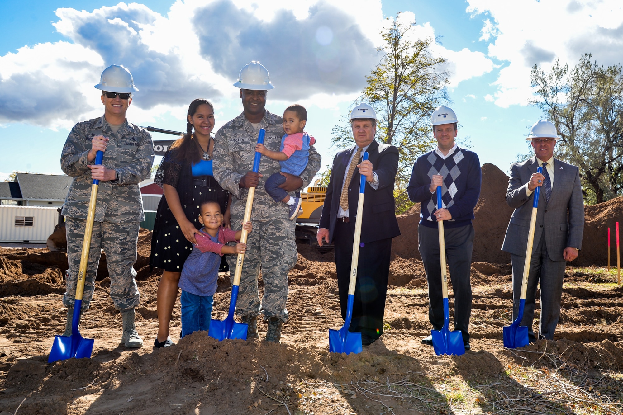 Members of the Air Force and the base's privatized housing contractor, Boyer Hill Military Housing, prepare to break ground on 10 new homes Oct. 19 at Hill Air Force Base, Utah. The homes will be made available to Hill AFB's junior enlisted military families. Left to right: Col. Jennifer Hammerstedt, 75th Air Base Wing commander; housing residents Staff Sgt. James Charnell Coates, his wife Charnell and their two children; Rulon Gardner, BHMH owner; Brent Pace, BHMH president; and Harry Briesmaster, 75th Civil Engineer Group director. (U.S. Air Force by R. Nial Bradshaw)
