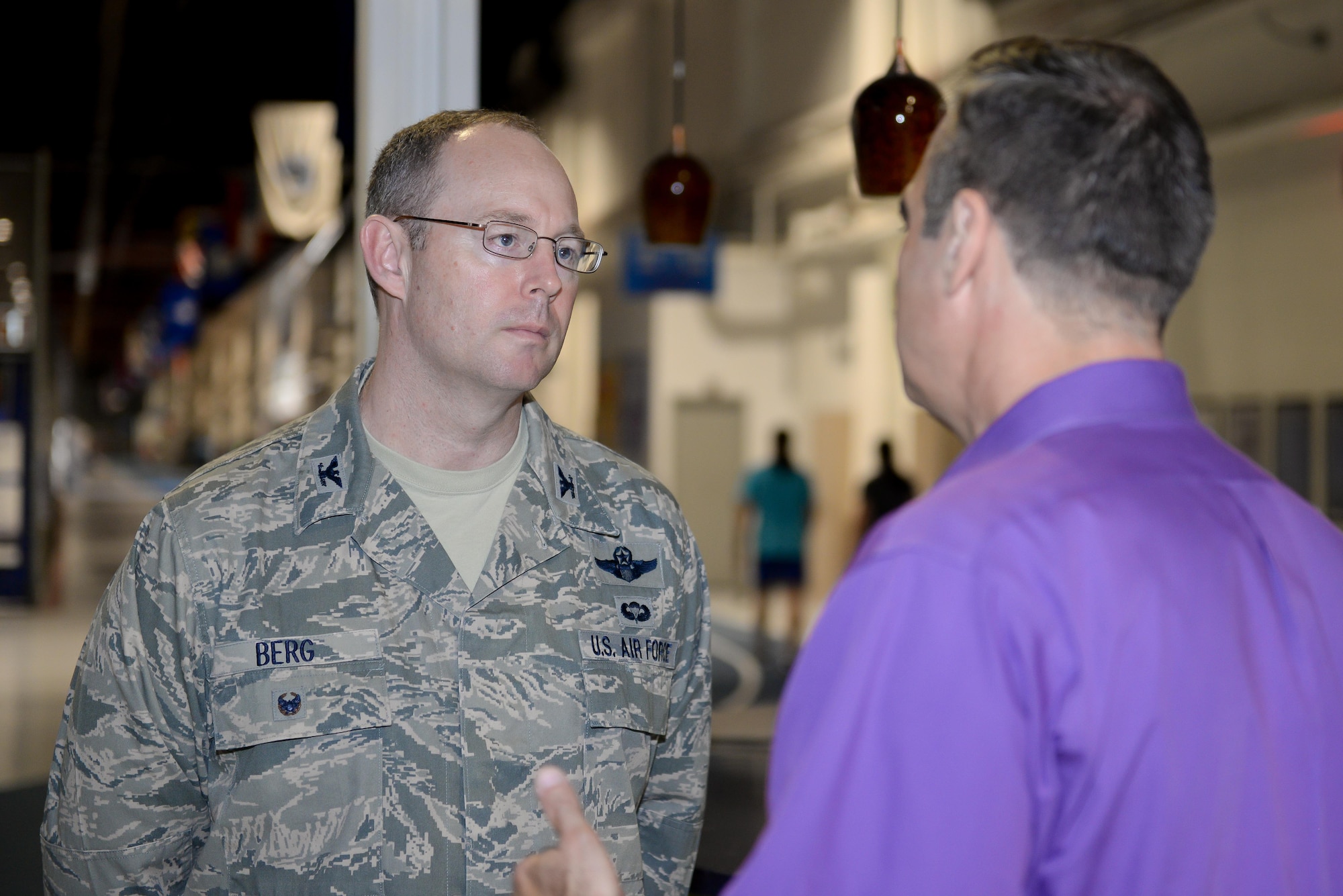 U.S. Air Force Col. David Berg (left), 55th Wing vice commander, talks with Kenneth Komyathy, family advocacy director, about the display set up to support Domestic Violence Awareness month in the Offutt Field House at Offutt Air Force Base, Neb., Oct. 18, 2016. According to the Department of Defense, domestic violence is an offense under the United States Code, the Uniform Code of Military Justice or state law that involves the use, attempted use, threat, use of force, violence against a person who is a current or former spouse, a person who shares a child with the abuser, a current or former intimate partner with whom the abuser shares a common domicile. (U.S. Air Force photo by Zachary Hada)