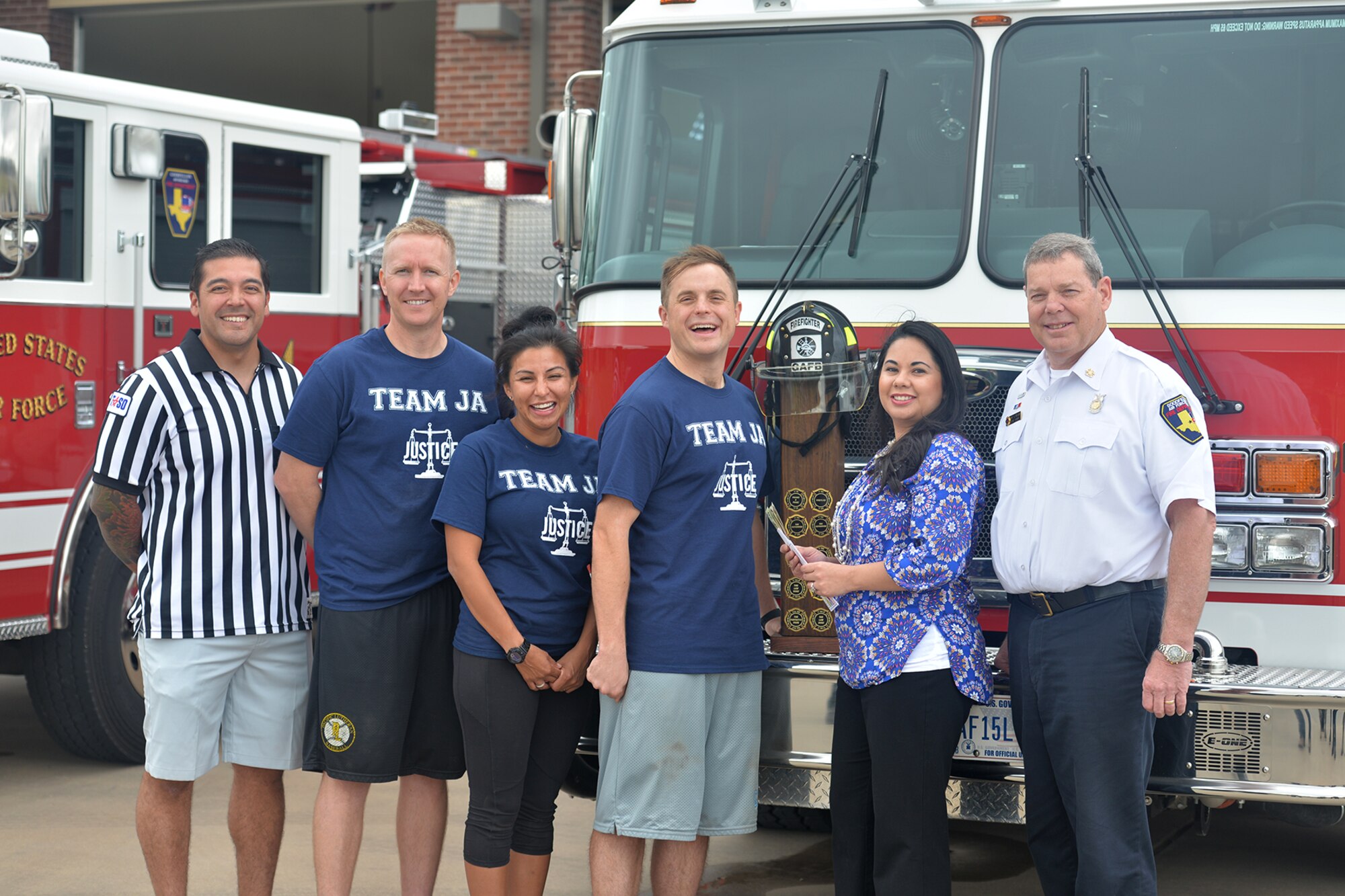 Team JA stands for a photo after winning the Annual Fire Muster Challenge at Goodfellow Air Force Base, Texas, Oct. 14, 2016. Team JA won with a time of 7 minutes and 47 seconds. (U.S. Air Force photo by Airman 1st Class Randall Moose/Released)