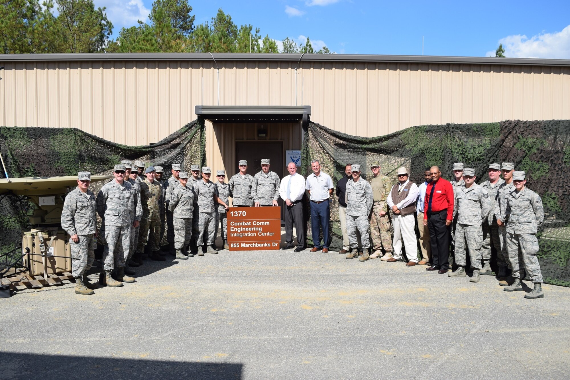 Members of the 5th Combat Communications Group, 226th Air National Gaurd, the Air Force Reserve Command A6, and several others pose in front of the new Combat Communications Engineering Integration Center at Robins AFB 19 Oct.