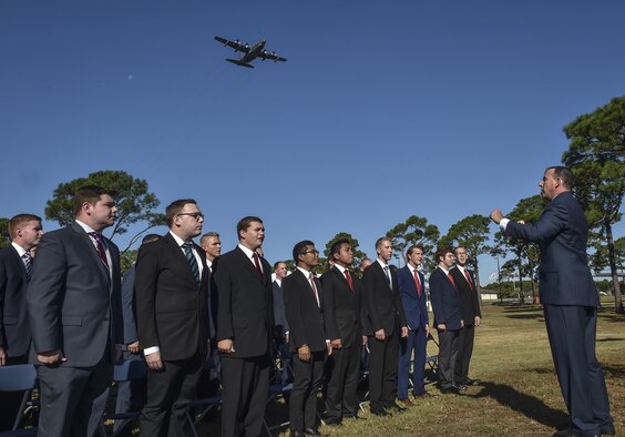 An MC-130H Combat Talon II performs a flyover as the Pensacola Christian College choir sings the National Anthem during the Special Tactics Memorial dedication ceremony at Hurlburt Field, Fla., Oct. 20, 2016. The nation’s first Special Tactics Memorial was dedicated at a ceremony with more than 800 people, presided over by Chief of Staff of the Air Force Gen. David Goldfein.(U.S. Air Force photo by Senior Airman Ryan Conroy) 