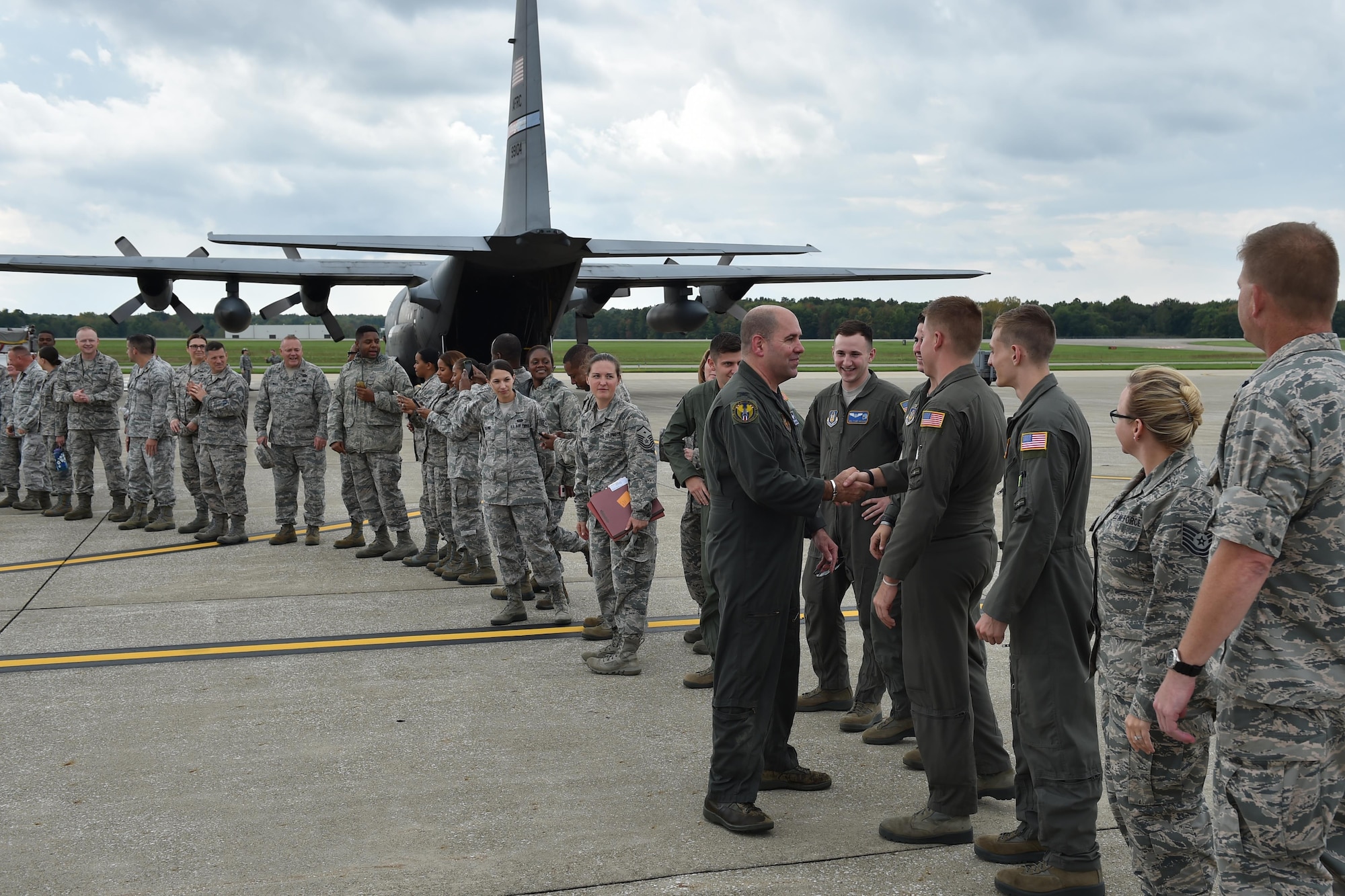 Col. James Dignan, 910th Airlift Wing commander, greets 910th Airlift Wing members after his final flight with the unit here, Oct. 2, 2016. Dignan moved to a new assignment at the Pentagon Oct. 18, after commanding YARS for nearly four years. (U.S. Air Force photo/Tech. Sgt. Jim Brock)