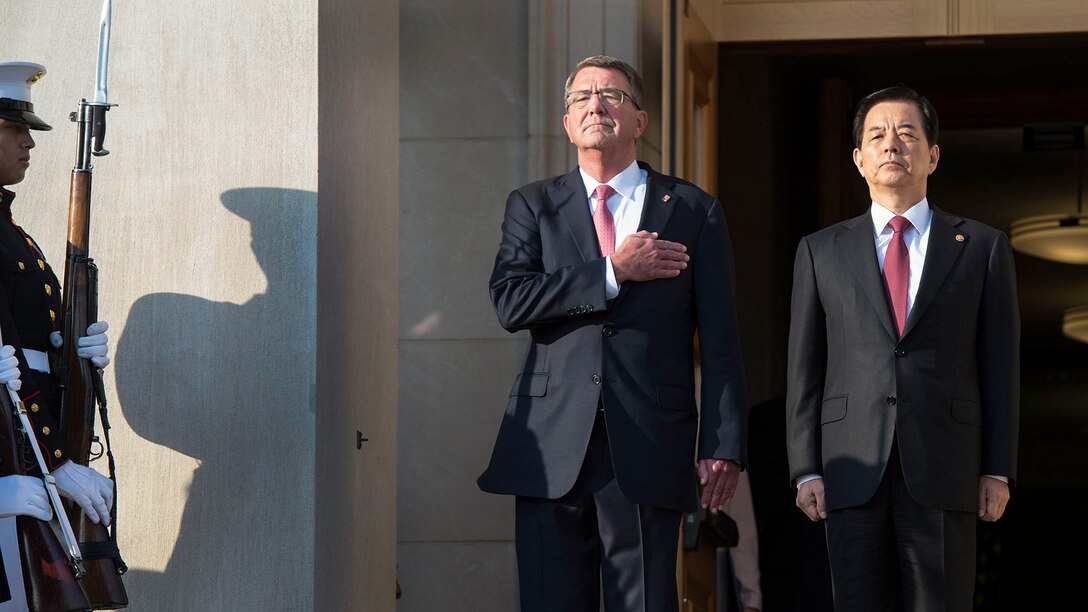 Defense Secretary Ash Carter and South Korean Defense Minister Han Min-koo observe the national anthem at the Pentagon, Oct. 20, 2016. The two leaders met to discuss matters of mutual importance. DoD photo by Navy Petty Officer 1st Class Tim D. Godbee