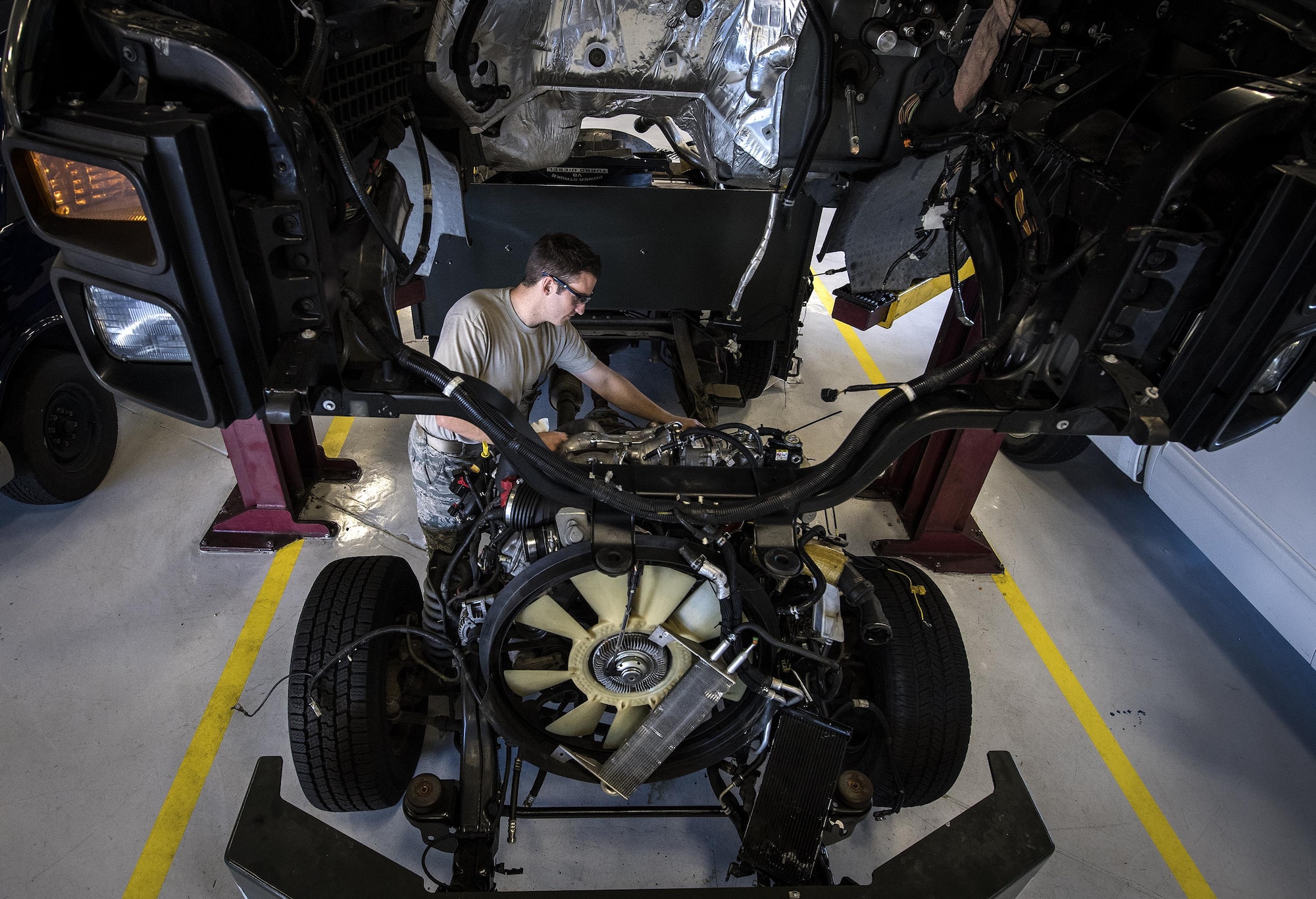 Senior Airman Corbin Mellor, 23d Logistics Readiness Squadron vehicle maintenance technician, checks the wiring on a vehicle, Oct. 20, 2016, at Moody Air Force Base, Ga. Technicians had to remove the cabin of the truck in order to replace the cylinder head and gaskets. (U.S. Air Force photo by Airman 1st Class Janiqua P. Robinson)