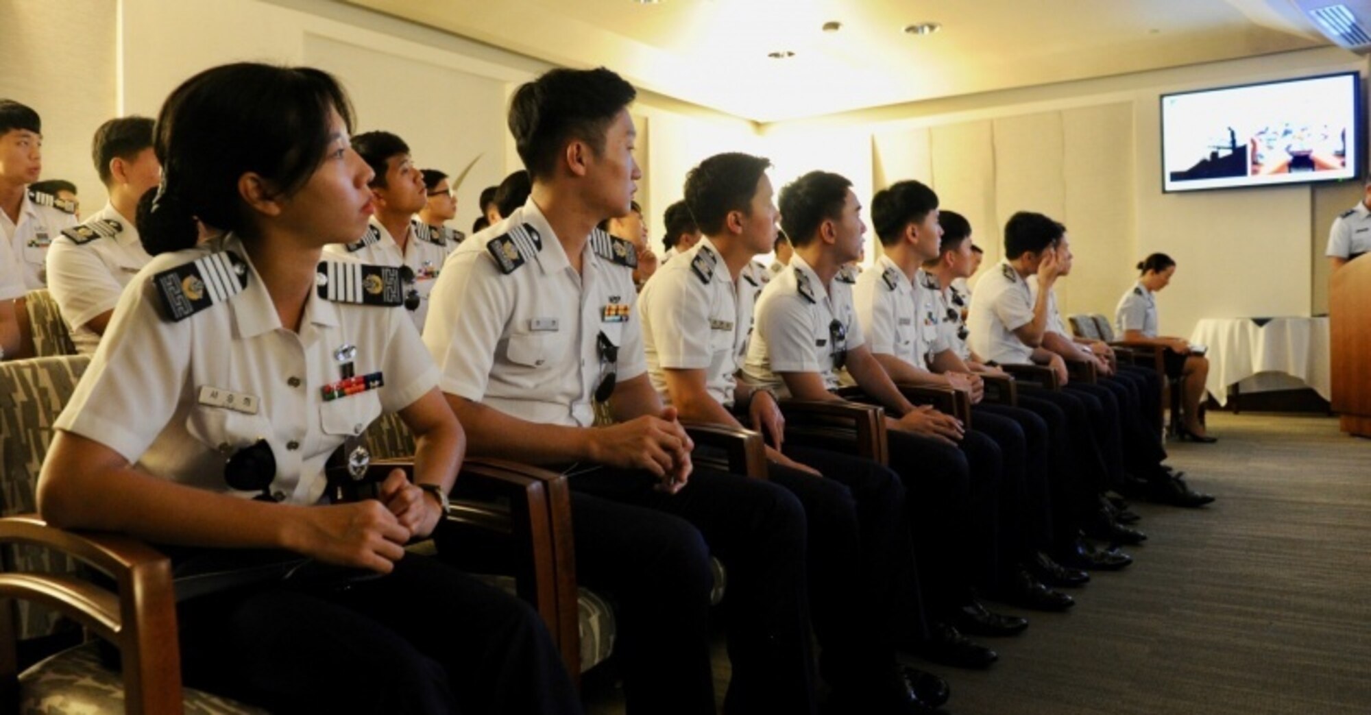 Republic of Korea Air Force (ROKAF) Academy cadets listen to a briefing during the recent Pacific Air Forces hosted ROKAF Academy cadet visit to Joint Base Pearl Harbor-Hickam, Hawaii, Oct. 19, 2016.  This marks the third visit by ROKAFA cadets who after commissioning, will likely work alongside U.S. forces on the Korean peninsula.  The visit is an opportunity for PACAF to show the cadets how PACAF and U.S. Pacific Command operate and gain a better understanding of the region and the importance of regional security.  (U.S. Air Force photo by Staff Sgt. Kamaile Chan)
