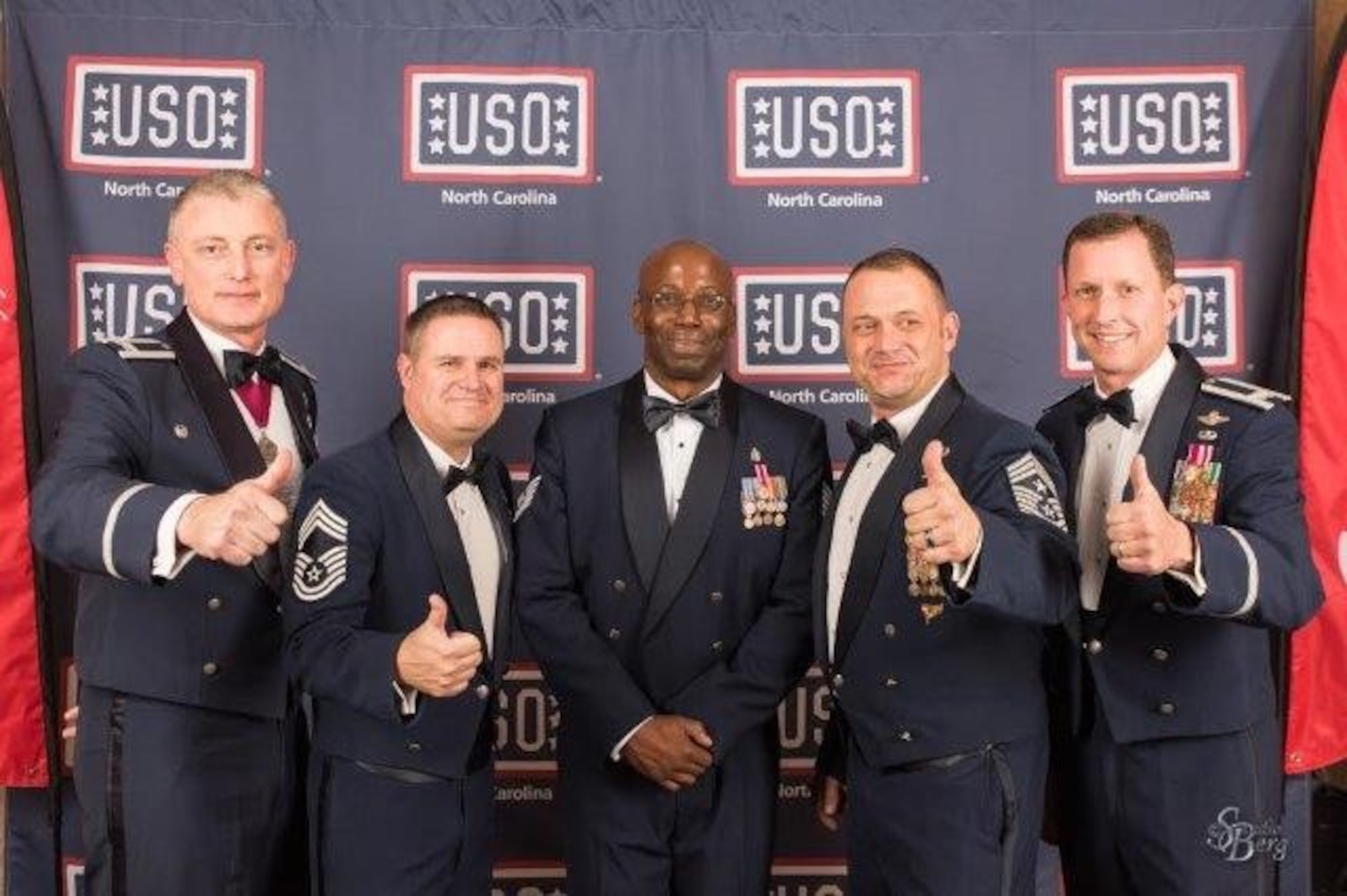 Tech. Sgt. Alfred Greene (center), 4th Medical Group aerospace medical service, takes a photo with 4th Fighter Wing and 4th MDG leadership at the United Service Organization Gala, Oct. 1, 2016, in Raleigh, North Carolina. Greene was nominated for the USO Service Member of the Year award due to his selfless volunteer work completed state-side, as well as overseas. 