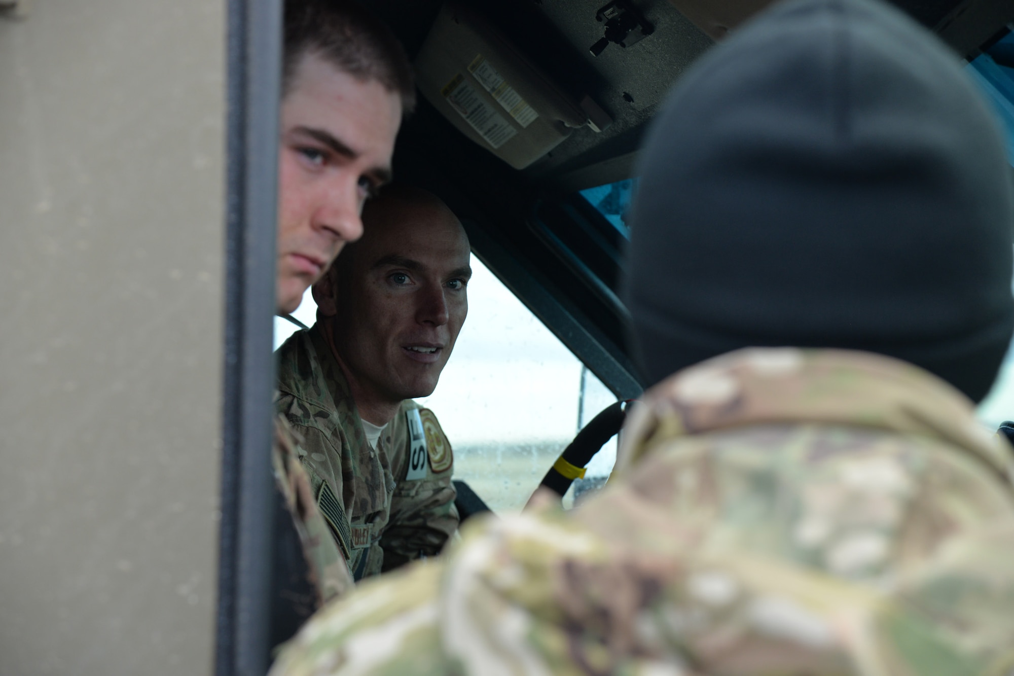 Staff Sgt. Patrick Currie, 741st Missile Security Forces Squadron convoy response force member, right, evaluates 1st Lt. Nathan Spradley, 741st MSFS CRF officer in charge, during a slalom exercise Oct. 19, 2016, at Malmstrom Air Force Base, Mont. Members from the Vehicle Dynamics Institute visited Malmstrom to train convoy response force Airmen on driving maneuverability exercises Oct. 10-21. (U.S. Air Force photo/Airman 1st Class Daniel Brosam)