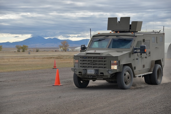741st Missile Security Forces Squadron convoy response force members drive through a slalom course Oct. 19, 2016, at Malmstrom Air Force Base, Mont. In the slalom, Airmen drove a Ballistic Armored Response Counter Attack Truck, otherwise known as a BEARCAT, through gravel at 15, 17, 20 and 22 miles per hour, avoiding evenly spaced cones while maintaining speed, simulating physical obstacles during an attack while escaping opposing forces. (U.S. Air Force photo/Airman 1st Class Daniel Brosam)