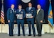 Gen. Robin Rand, Global Strike Command commander, left, and retired Brig. Gen. Scott Van Cleef, Air Force Association alumni, right, present the General Thomas S. Power Award to Capt. Ian Sylvester and 1st Lt. Michael McCrary, both of 341st Operations Group, at the Air, Space and Cyber Conference National Aerospace Awards, hosted by the Air Force Association on Washington D.C., Sept. 19.  This award is presented to the best missile team in the Air Force.  
